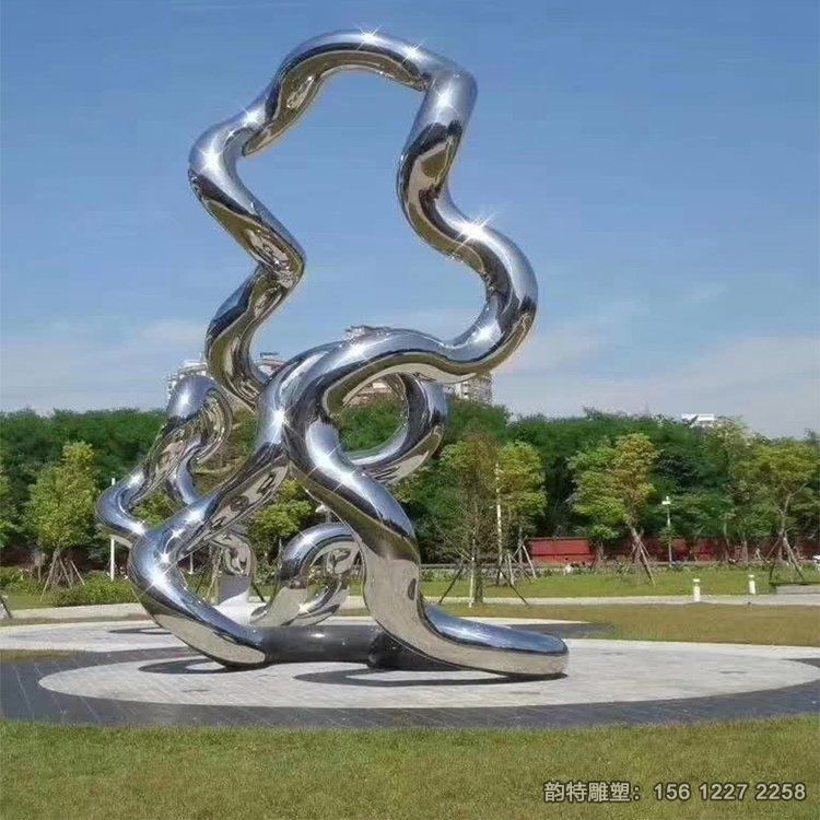 廣場不銹鋼鏡面飄帶雕塑，扭曲飄帶絲帶雕塑造型